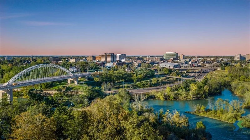 A panoramic view of St. Catharines, showcasing the bridge and vibrant skyline in the distance.